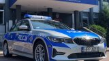 radiowóz oznakowany bmw na tle KMP Jaworzno